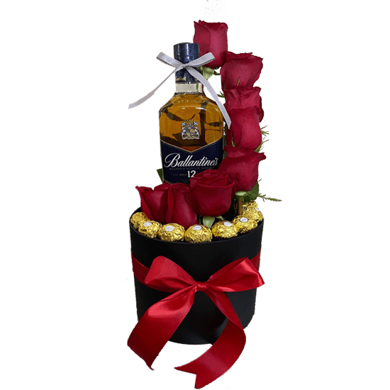Caja clindrica con 8 rosas, bombones ferrero y Whisky